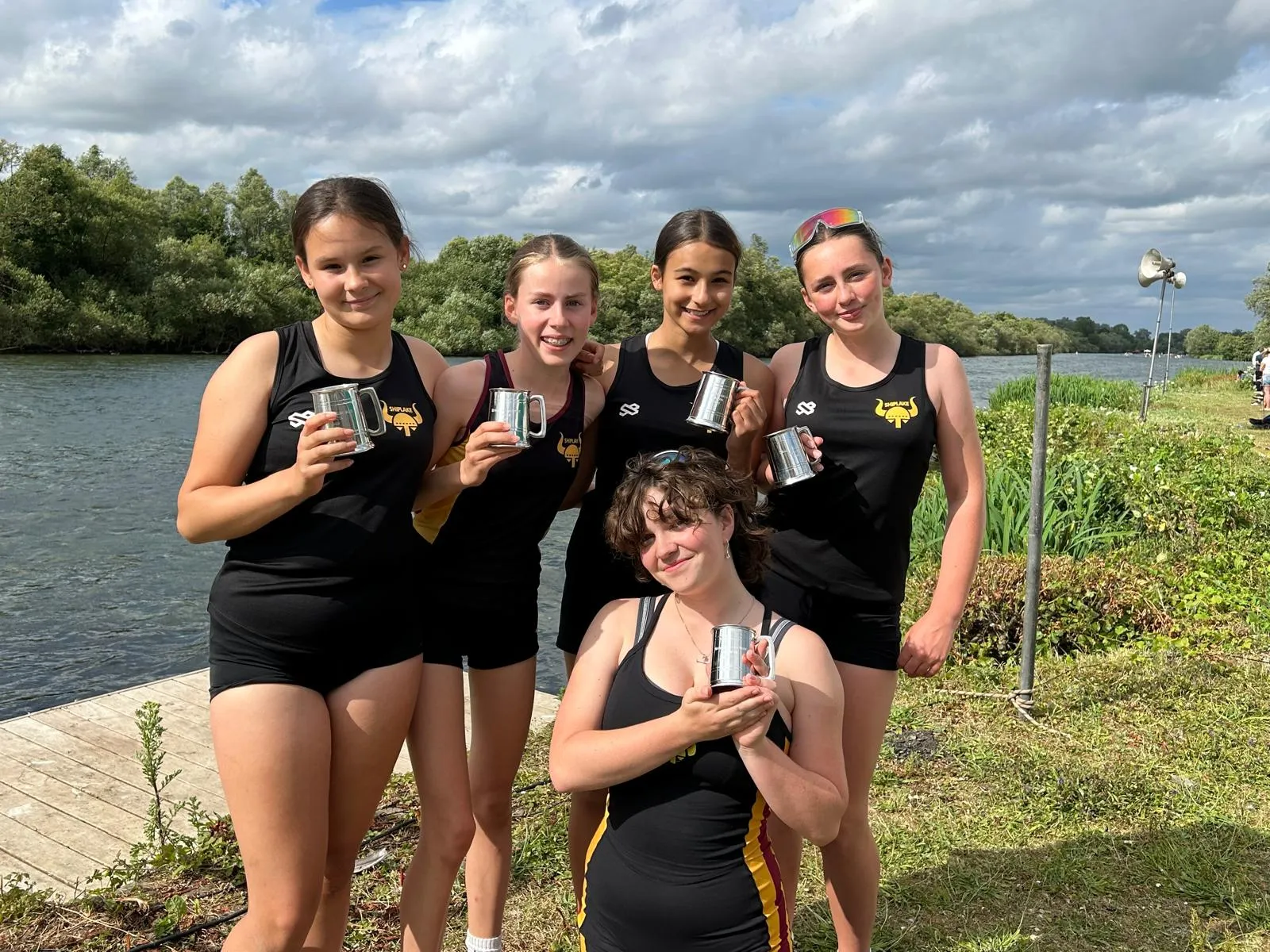 Shiplake Vikings junior girls crew with winning trophies