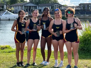 Shiplake vikings girls crew with winning trophies