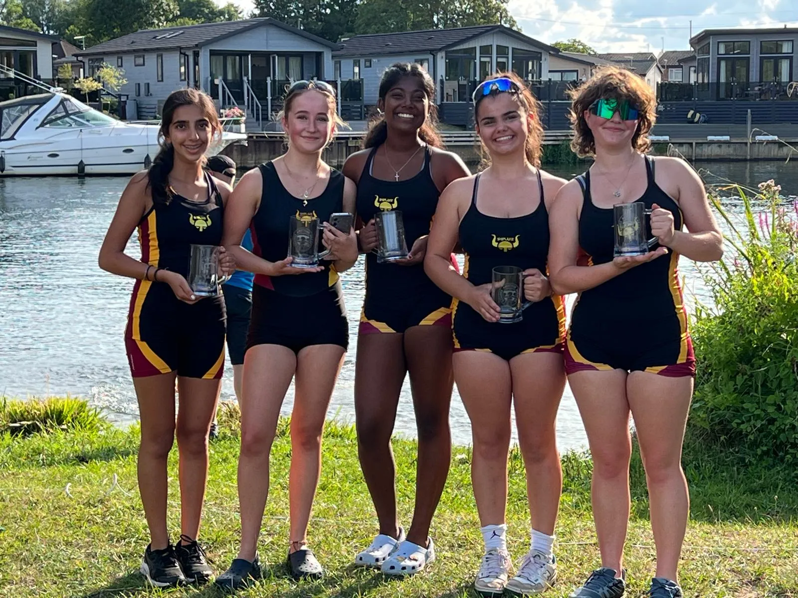 Shiplake vikings girls crew with winning trophies