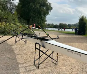 The newly renamed Jeremy Laming coxless quad on trestles beside the River Thames at Shiplake Vikings Rowing Club