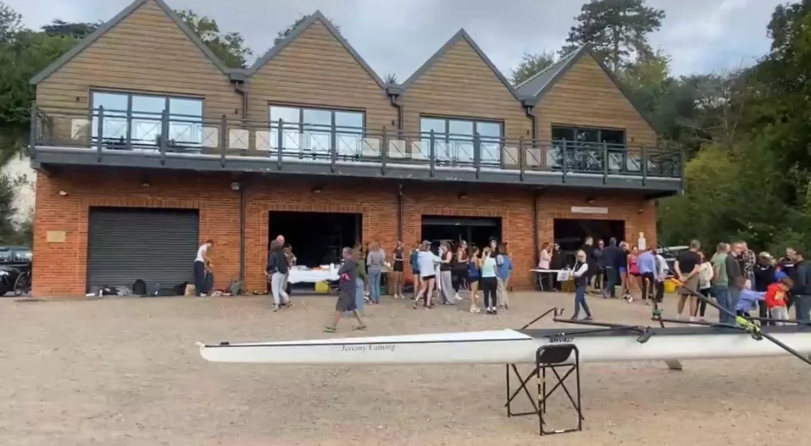 Shiplake Vikings Rowing Club members, juniors and parents gathered outside the boathouse with refreshment tables on triathlon day